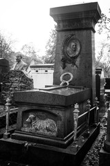 Fototapeta premium Paris, France - November 18, 2019: Graves and crypts in Pere Lachaise Cemetery, This cemetery is the final resting place for many famous people