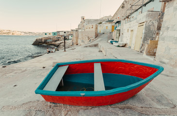 Fototapeta premium Colorful fishermen boats on land of Valletta city, Malta. Mediterranean landscape