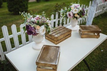 Decor for events from natural flowers, white orchid and wooden elements.