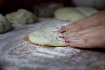 The process of making buns with tea. Raw dough for baking in the oven.