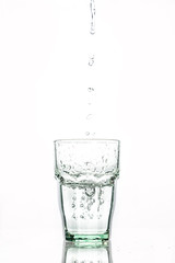 in glass transparent the glass pours clean water