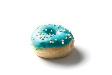 Doughnut on bright light blue background.