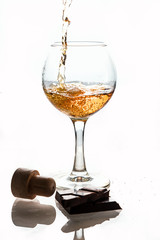 strong alcohol is poured into a glass glass