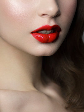 Sexual full lips. Natural gloss of lips and woman's skin. The mouth is closed. Increase in lips, cosmetology. red lipstick. Open mouth and with teeth. brunet hair. Red lip gloss