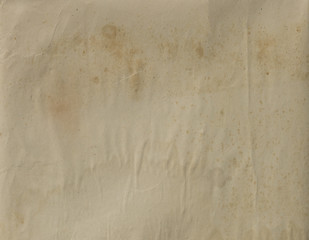 vintage texture of an empty old yellowed crumpled sheet of paper