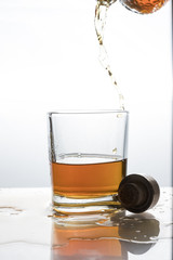 A frozen glass tumbler and strong alcohol.