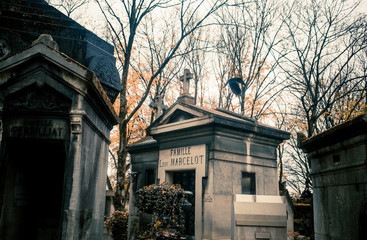 Paris, France - November 18, 2019: Graves and crypts in Pere Lachaise Cemetery, This cemetery is the final resting place for many famous people