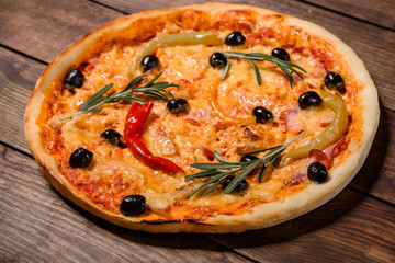 Tasty fresh hot pizza against a dark background. Pizza, food, vegetable, mushrooms