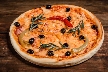 Tasty fresh hot pizza against a dark background. Pizza, food, vegetable, mushrooms
