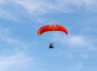 Athletes on  a motorized parachute fly at low altitude above the Mediterranean coast near Caesarea in northern Israel