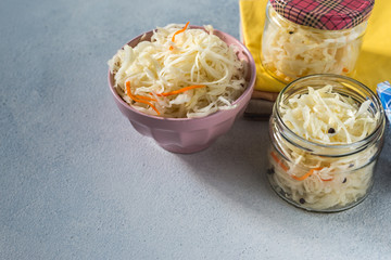  fermented sauerkraut village vegan salad in a glass jar. healthy product. rustic food. Probiotics concept.