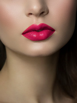 Sexual full lips. Natural gloss of lips and woman's skin. The mouth is closed. Increase in lips, cosmetology. pink lipstick. Open mouth and with teeth. brunet hair. pink lip gloss