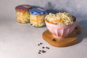  fermented sauerkraut village vegan salad in a glass jar. healthy product. rustic food. Probiotics concept.