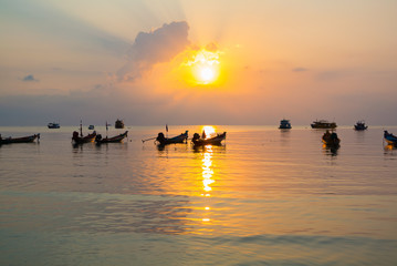 Sunset on a beach with boats, Ko Tao,Thailand