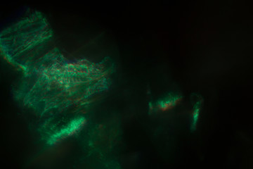 Blurred lens flare. Defocused colorful lights. Shiny glowing spots, abstract background and texture