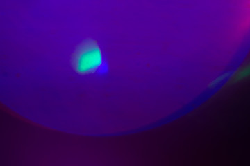 Blurred lens flare. Defocused colorful lights. Shiny glowing spots, abstract background and texture