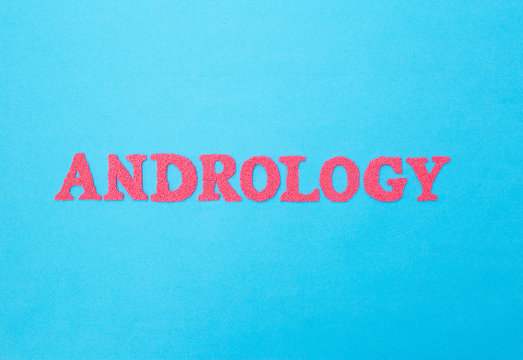 Word andrology of red letters on a blue background. The concept of the section of medicine dealing with the disease of the male genital area, oncoandrology