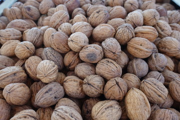 closeup of walnuts on display at the market