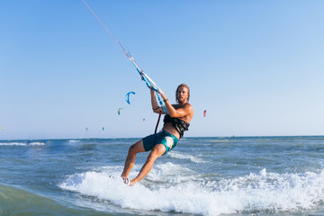 Man Kitesurfing on the Sea