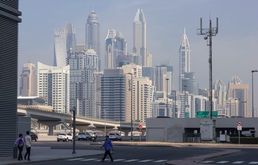 road in Dubai, with skyscraper modern building in the background