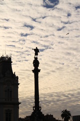 Fototapeta premium Cropped silhouette against the sky of the statue of Columbus in the city of Barcelona Cloudy sunset in winter in the city of Barcelona, ​​Spain