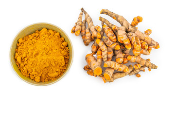 fresh turmeric root and turmeric powder in spoon on white background