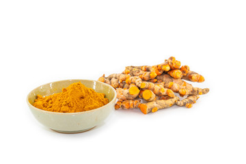 fresh turmeric root and turmeric powder in spoon on white background