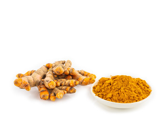 fresh turmeric root and turmeric powder in spoon on white background