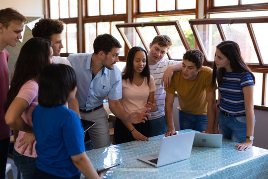 Teenagers and teacher in classroom