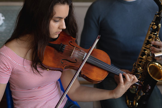 Teenage musicians rehearsing
