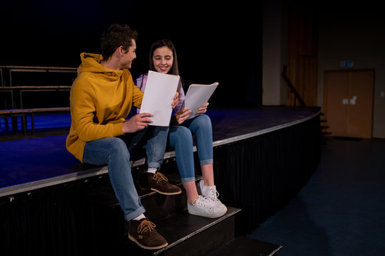 Teenagers rehearsing in a theatre