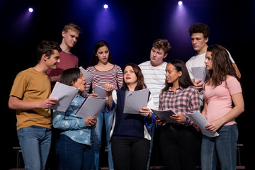 Teenagers rehearsing in a theatre