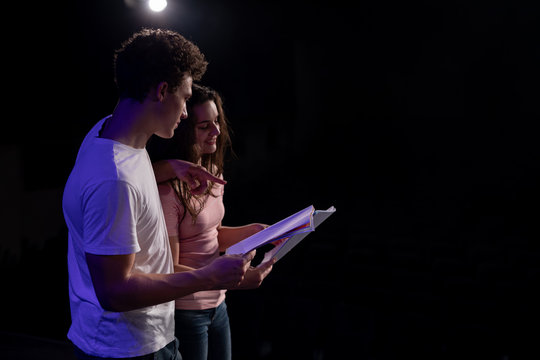 Teenagers rehearsing in a theatre