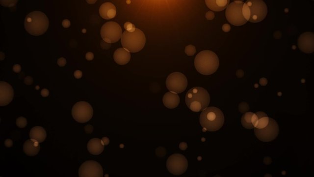 Dust particles bokeh gold lights on Black Background. 4k Footage