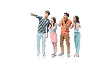 excited man pointing and showing something to shocked friends, isolated on white