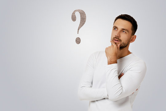 portrait of doubtful bearded man in casual white shirt asking questions isolated on white background.
