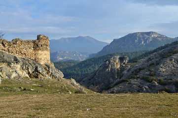 Fototapeta premium Byzantine castle ruin of Sidirokastro in the Northern Greece is also a great vantage point that looks to all directions. Limestone mountains of Angistro are the backdrop.