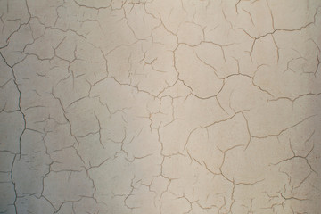 Old weathered and cracked vintage stone wall. Black and white background.