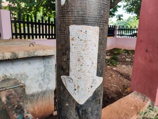 Down arrow on the pipe