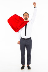 Young business man hero with fist up isolated on white background