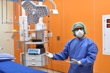 surgeon at work in operating room. Surgical light in the operating room. Preparation for the...