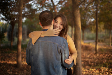 man is proposing to beautiful girl