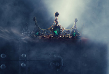 mysterious and magical photo of of beautiful queen/king crown over gothic dark background. Medieval...
