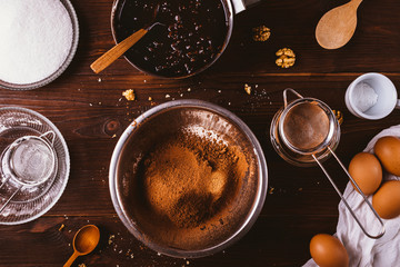Sifted cocoa powder and flour in metal bowl