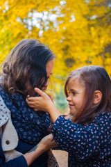 Fototapeta premium Mother and daughter little girl in the forest.