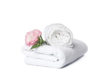 Obraz na płótnie Canvas Towels and beautiful flower isolated on white background