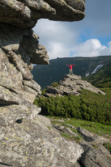 Naklejka premium People among the majestic mountains