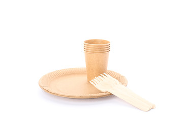 Eco - friendly plate with forks and cups isolated on white background. Disposable tableware