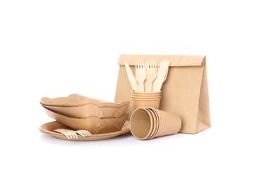 Eco - friendly tableware and paper bag isolated on white background. Disposable dishes