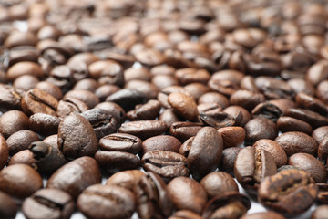 Textured background of coffee beans, close up